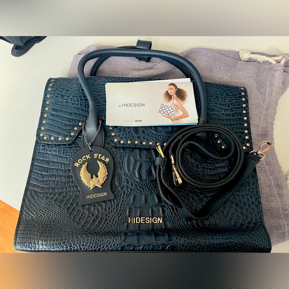 Hidesign blue purse, brand new never used with cover bag.